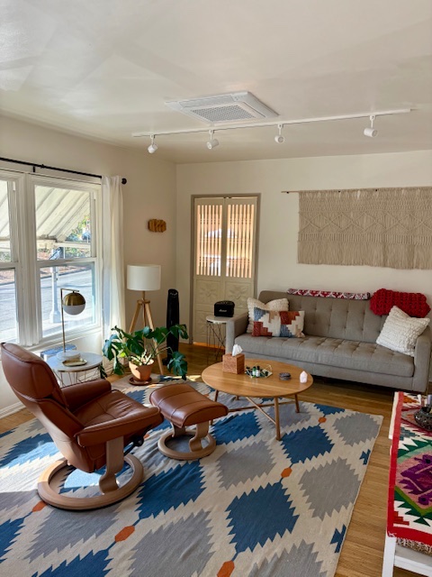 Warm, inviting therapy room with comfortable seating and natural light